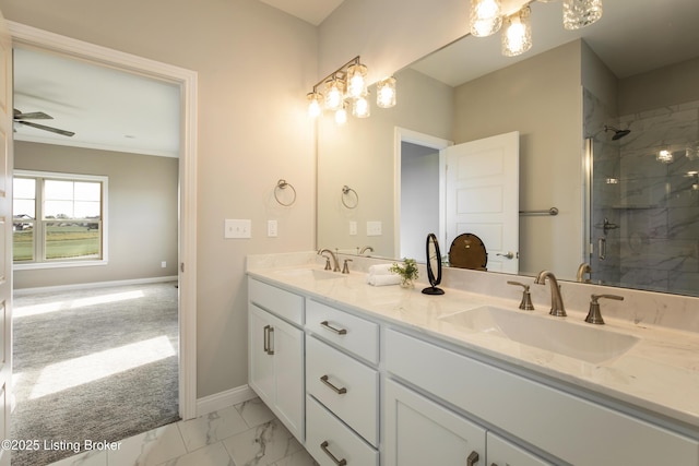 bathroom featuring ceiling fan, vanity, and walk in shower