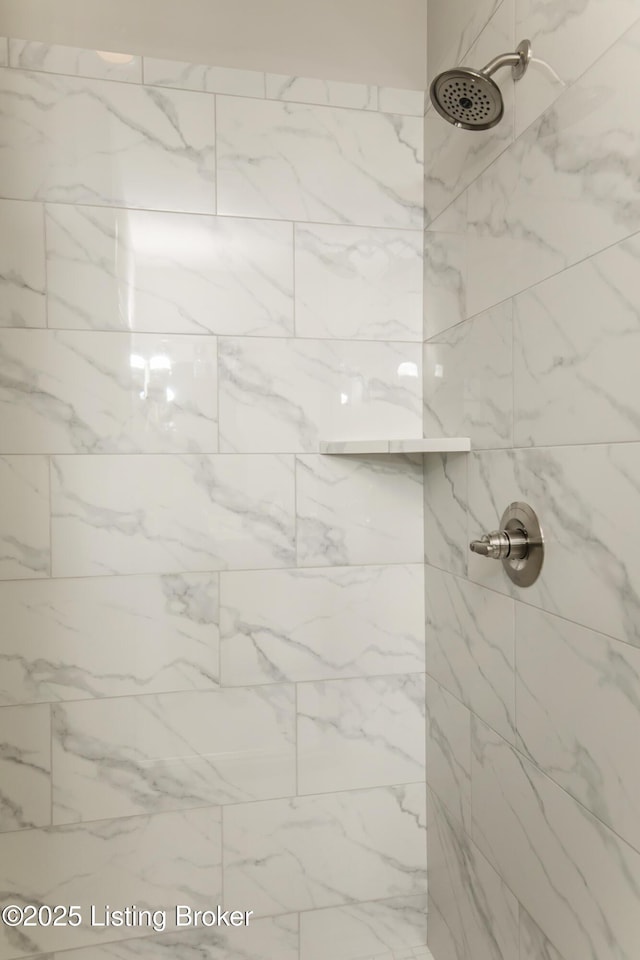 bathroom with tiled shower