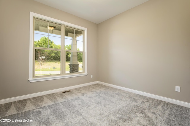 spare room featuring carpet floors