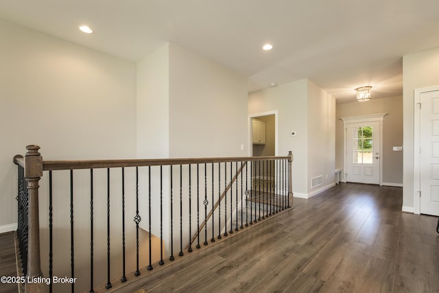 hall with dark wood-type flooring