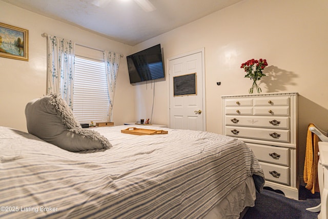 carpeted bedroom featuring ceiling fan