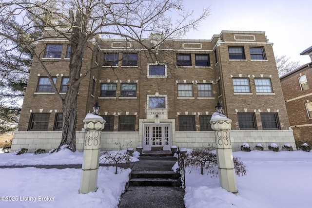 view of snow covered property