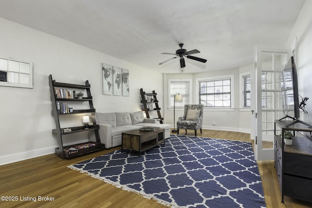 living room with ceiling fan and hardwood / wood-style floors