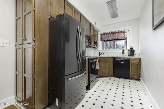 kitchen with sink and black appliances