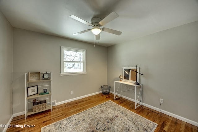 miscellaneous room with ceiling fan, baseboards, and wood finished floors