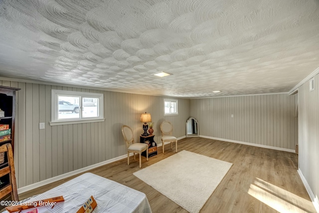 sitting room with wood finished floors and baseboards