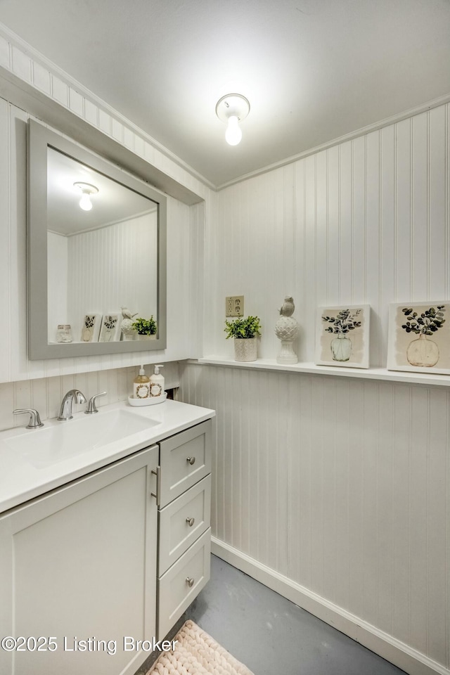 bathroom with concrete floors and vanity