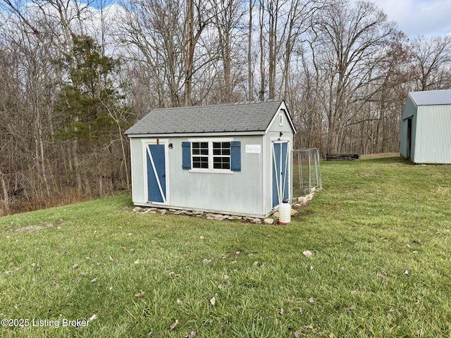 view of outbuilding featuring a lawn