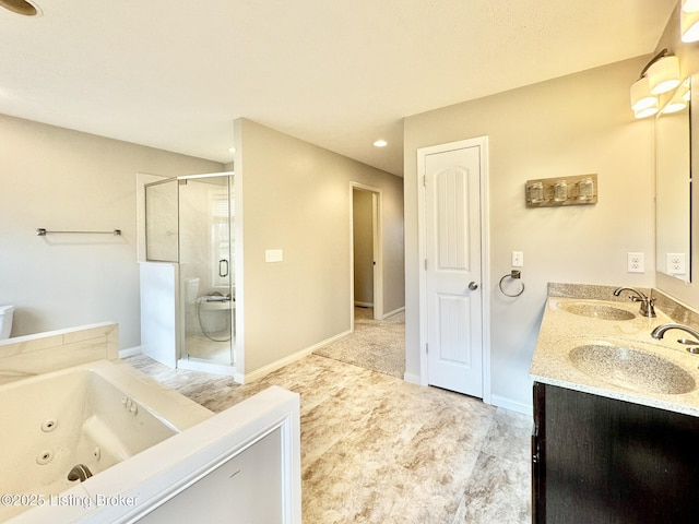 bathroom with vanity and independent shower and bath