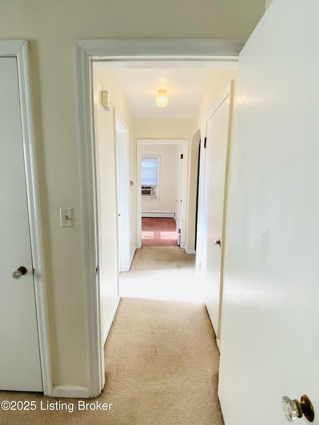 hall featuring baseboard heating and light carpet