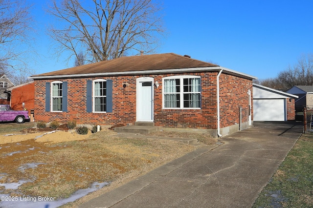 view of front of property featuring a garage and an outdoor structure