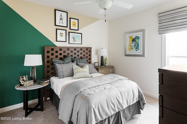 bedroom featuring ceiling fan and light carpet