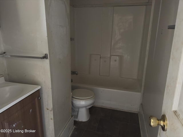 full bathroom with vanity, washtub / shower combination, and toilet