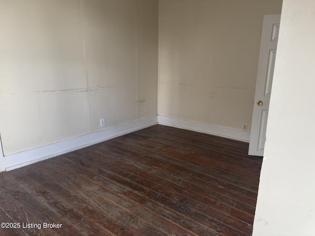 empty room featuring dark wood-type flooring