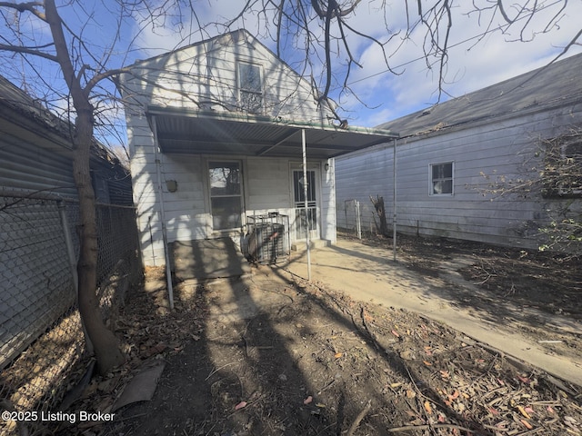 back of property featuring central AC unit