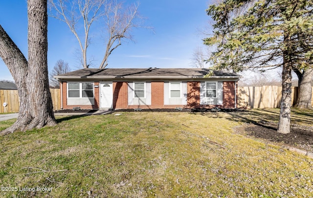 ranch-style house featuring a front lawn