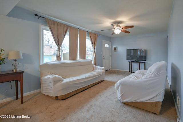 living room with light carpet and ceiling fan