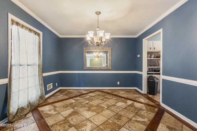 unfurnished dining area featuring ornamental molding and a notable chandelier