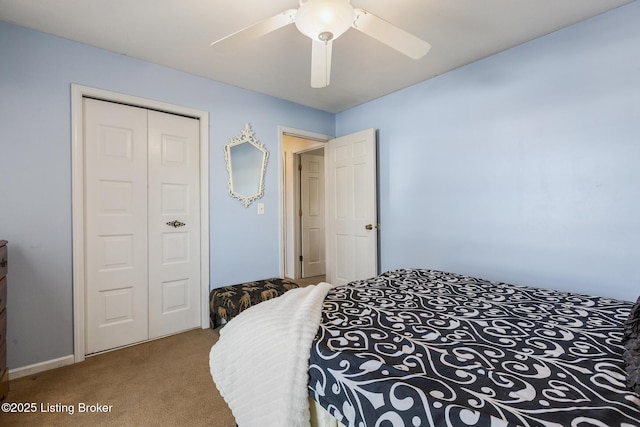 carpeted bedroom featuring a closet and ceiling fan