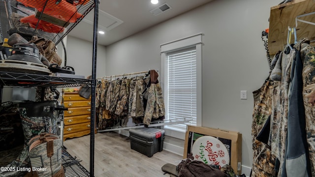 spacious closet featuring light hardwood / wood-style floors