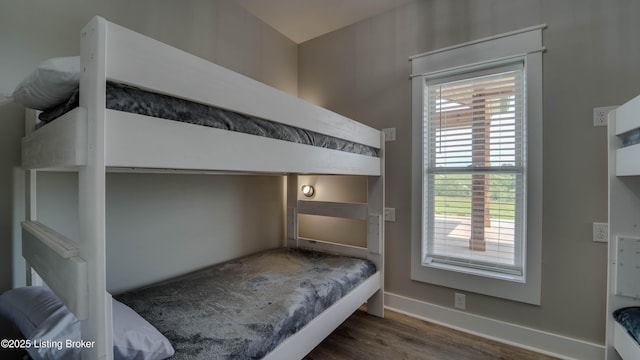 bedroom featuring dark wood-type flooring