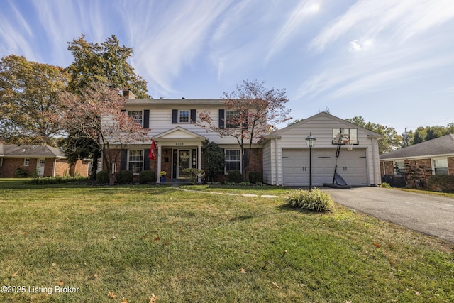 view of front facade featuring a garage and a front yard