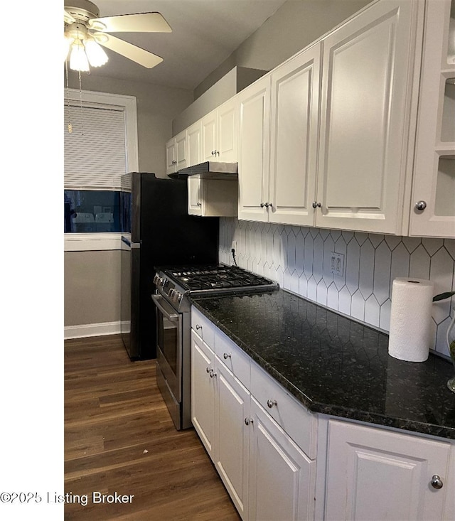 kitchen featuring backsplash, stainless steel range with gas cooktop, and white cabinets