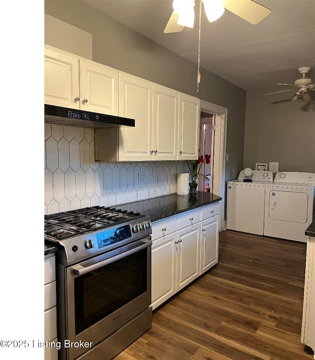 kitchen featuring backsplash, stainless steel stove, white cabinetry, and washing machine and clothes dryer