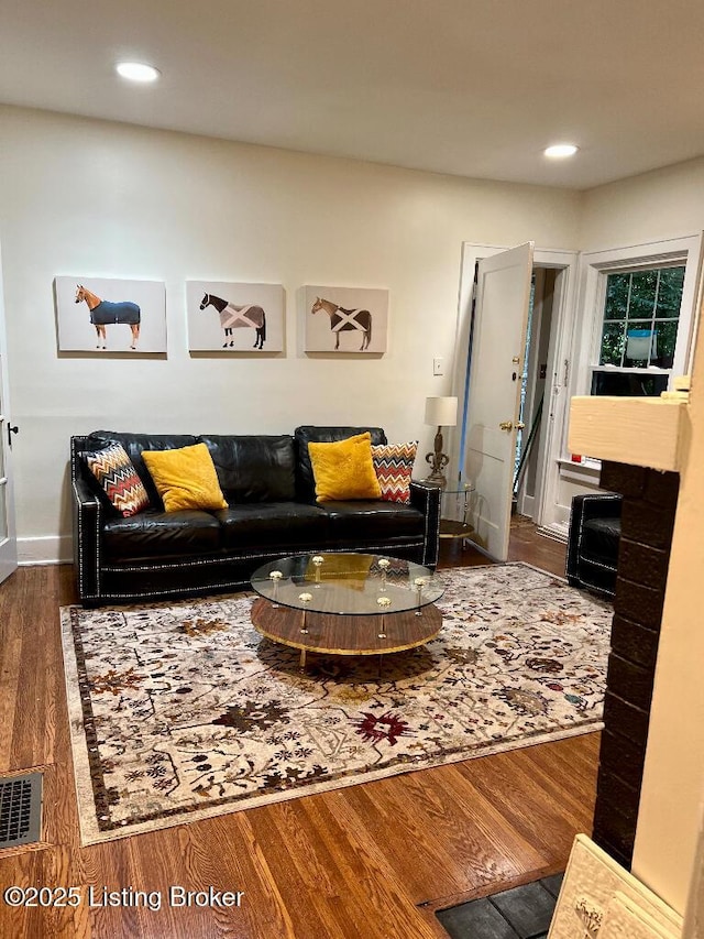 living room with dark wood-type flooring