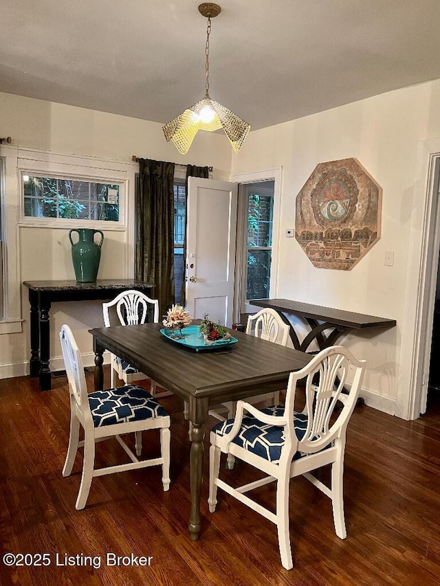 dining area featuring dark hardwood / wood-style floors