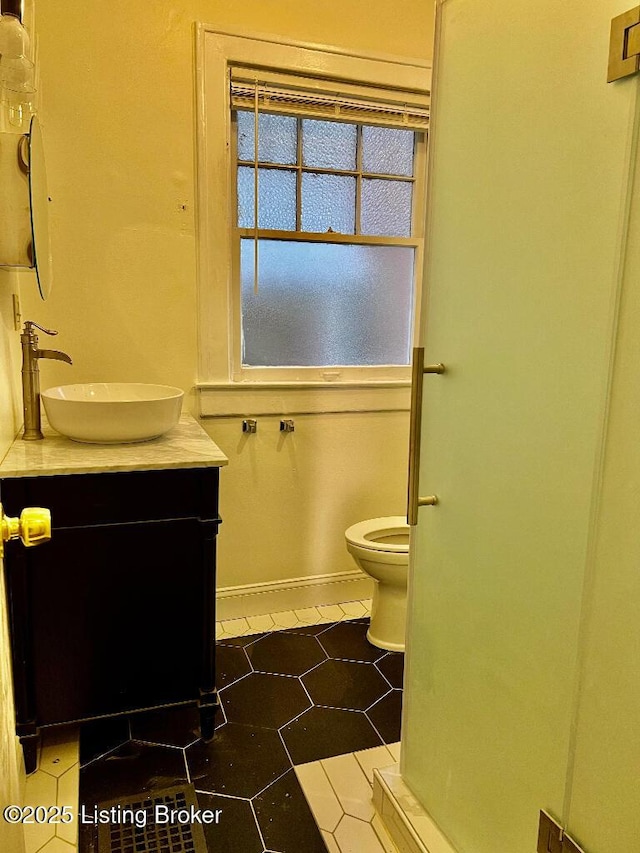 bathroom with vanity and toilet