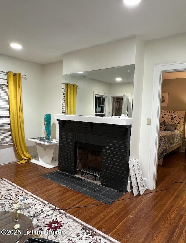 details with a fireplace and hardwood / wood-style flooring