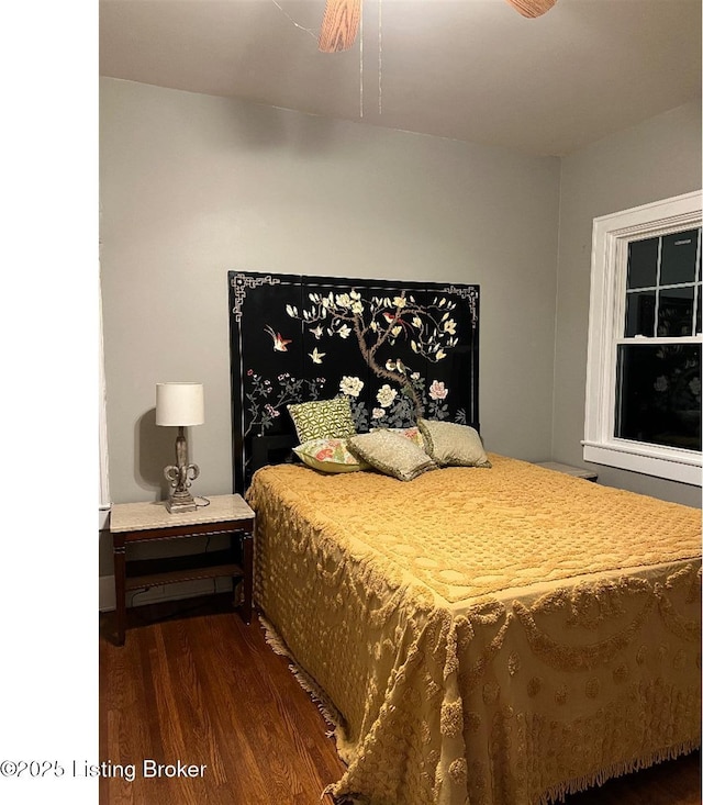 bedroom featuring dark hardwood / wood-style floors and ceiling fan