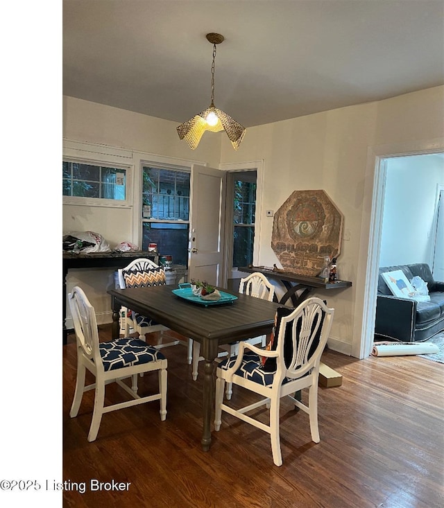 dining room featuring ceiling fan and wood-type flooring