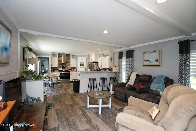 living room with ornamental molding, plenty of natural light, and dark wood-type flooring