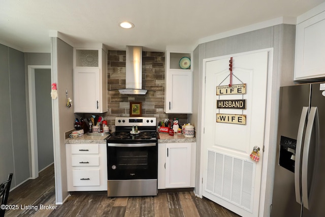 kitchen with white cabinets, stainless steel appliances, and wall chimney exhaust hood