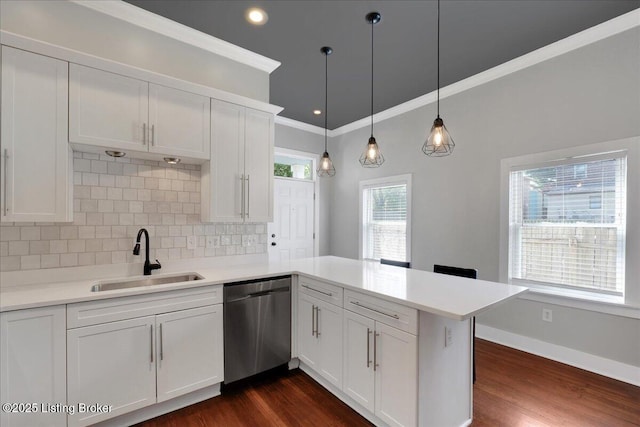 kitchen featuring dishwasher, sink, dark hardwood / wood-style floors, kitchen peninsula, and decorative backsplash