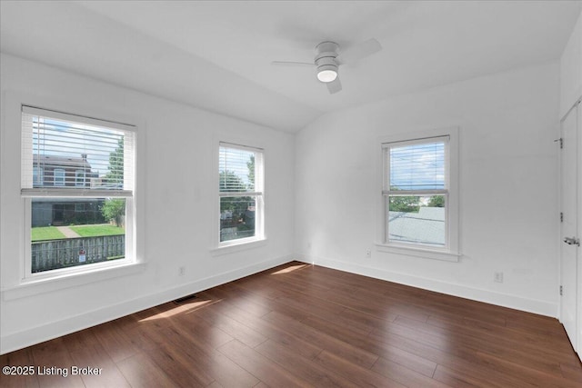 empty room with ceiling fan, dark wood-type flooring, and lofted ceiling