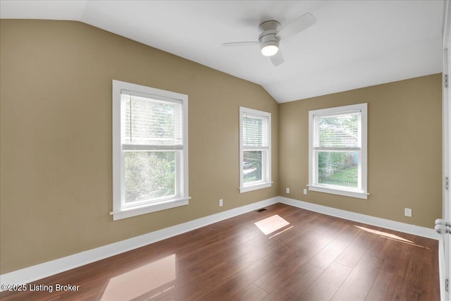 spare room featuring wood-type flooring, ceiling fan, and lofted ceiling