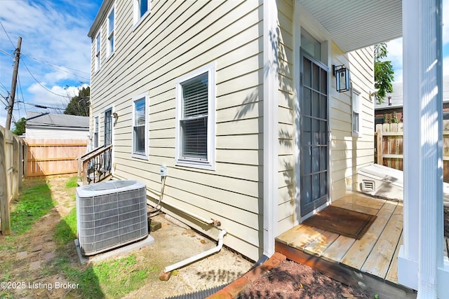 view of side of home featuring central AC