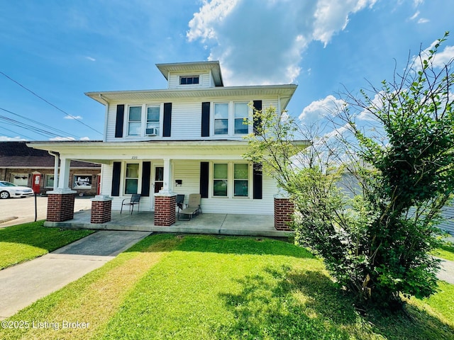 view of front of house featuring a front lawn and covered porch