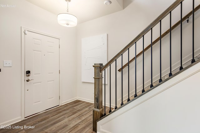 foyer with dark wood-type flooring