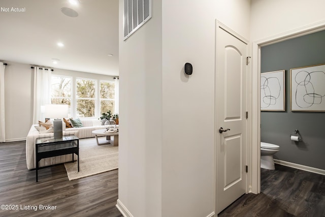 hall with dark hardwood / wood-style floors