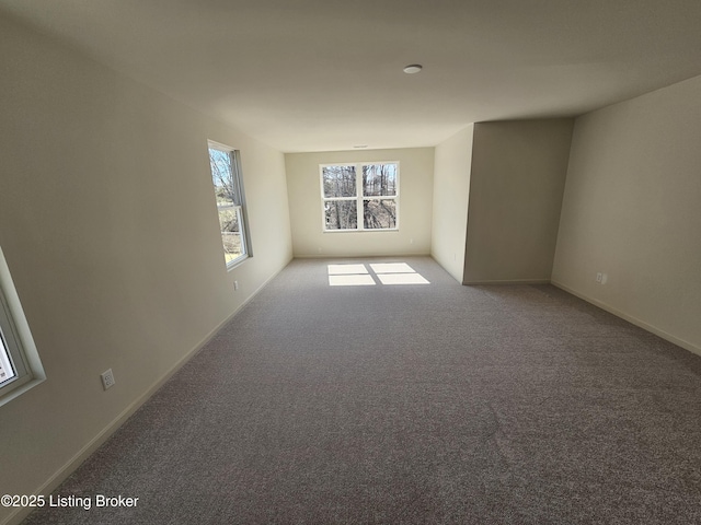 empty room with carpet flooring and baseboards