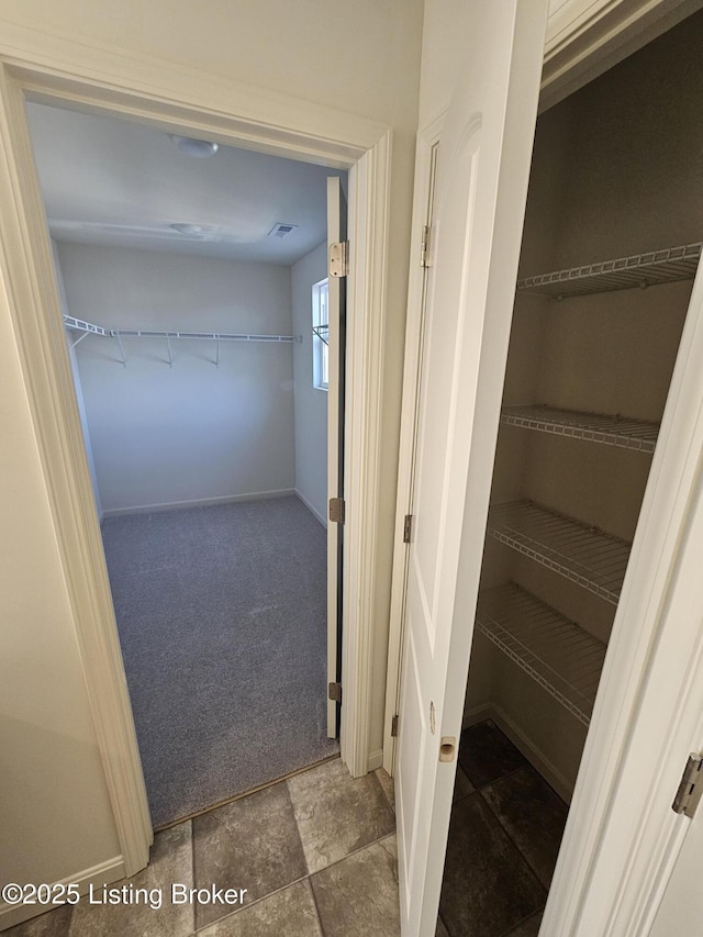 closet featuring visible vents