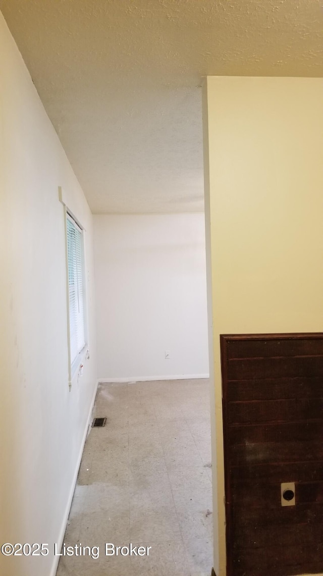 empty room with a textured ceiling