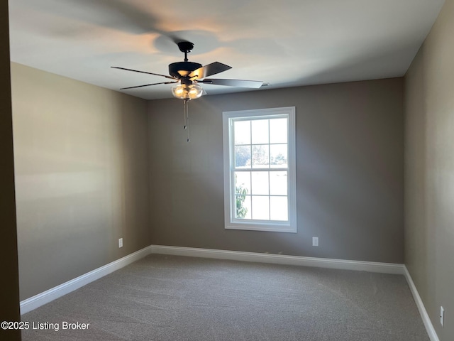 carpeted empty room with ceiling fan