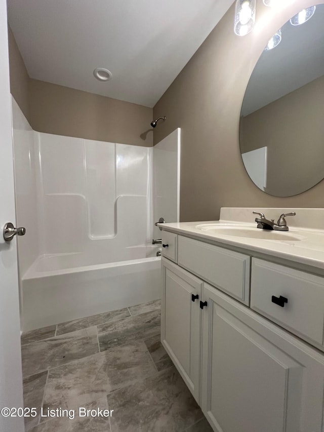 bathroom with vanity and bathing tub / shower combination