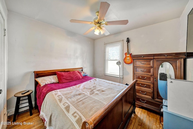 bedroom featuring ceiling fan and hardwood / wood-style floors