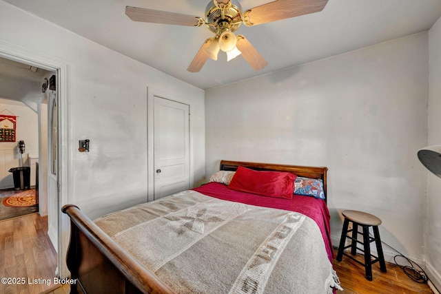 bedroom featuring ceiling fan and light wood-type flooring